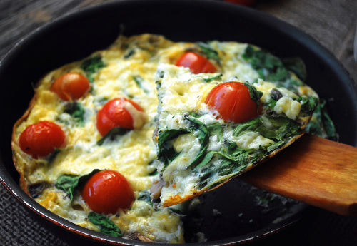 Breakfast Casserole, Spinach Frittata. Our homemade frittata, the classic Italian omelette, is made with farm raised eggs, sautéed spinach, sun-dried tomatoes, sweet cherry tomatoes, pine nuts and blended with cream and goat cheese.
