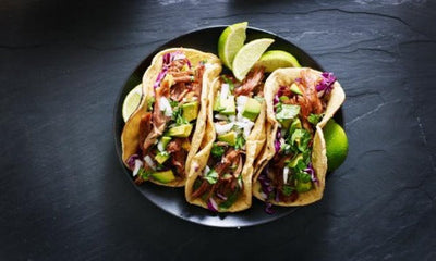 Our trio of brisket tacos are made with slow cooked brisket, sautéed in a mélange of onions, tomatoes, peppers and garlic, topped with Monterey Jack cheese. Served with a flour tortillas, flavorful tomatillo salsa, and red salsa packet!