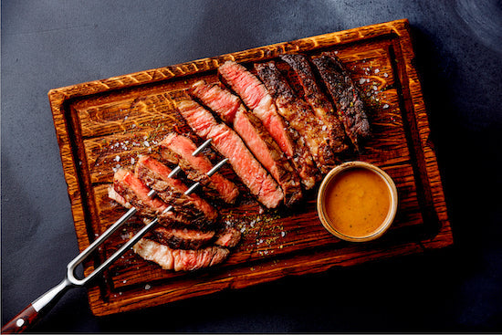 Our juicy skirt steak is bursting with juicy rich flavor. Marinated overnight for outstanding flavor with exceptional marbling and tenderness.  Our skirt steak is served rare with cognac peppercorn sauce, roasted asparagus and seasonal veggies. Low carb meal.