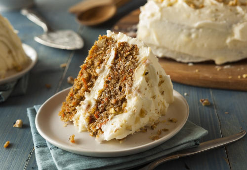 Carrot Cake. Tasty and moist carrot cake slice with a hint of crushed pineapple sweetness, topped with our homemade cream cheese frosting.